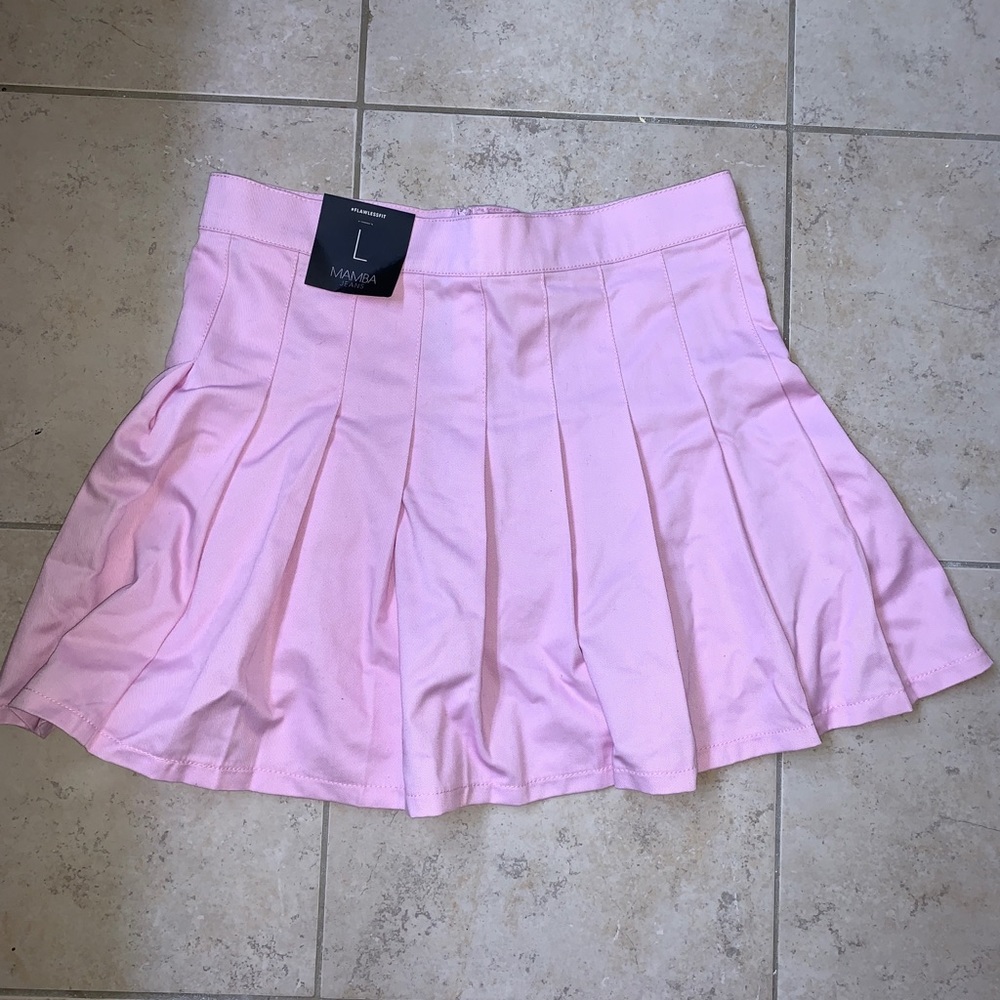 Mamba Jeans, pink pleated skirt.